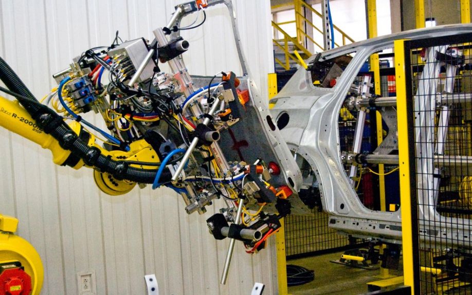 http://st.motortrend.com/uploads/sites/5/2012/04/Ford-Factory-Laser-Eye-Robot-installing-door.jpg