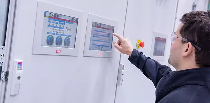 A picture of a man programming KEB's Panel HMIs