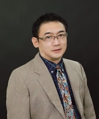 A person in a suit and tieDescription automatically generated